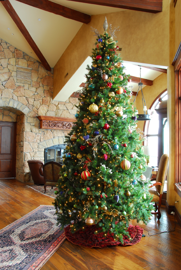 Seasonal holiday décor arrangement with evergreen foliage and warm accents