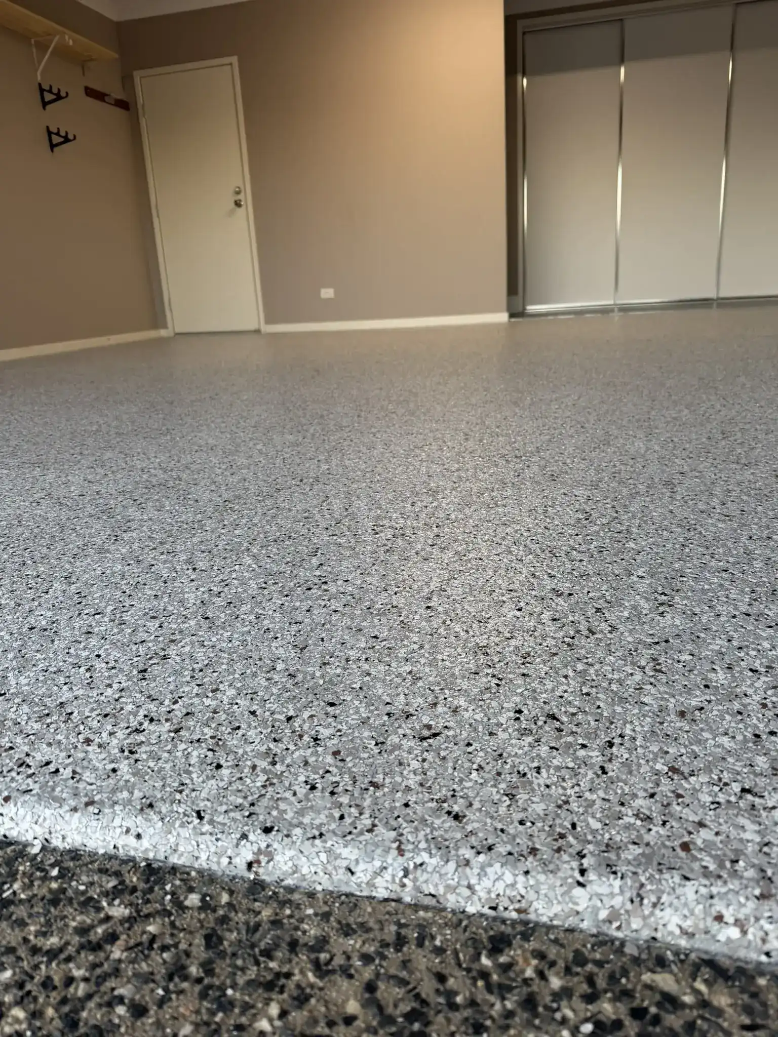 Epoxy garage floor coating in Caloundra by Best Coat Epoxy with a heavy-duty slip-resistant topcoat