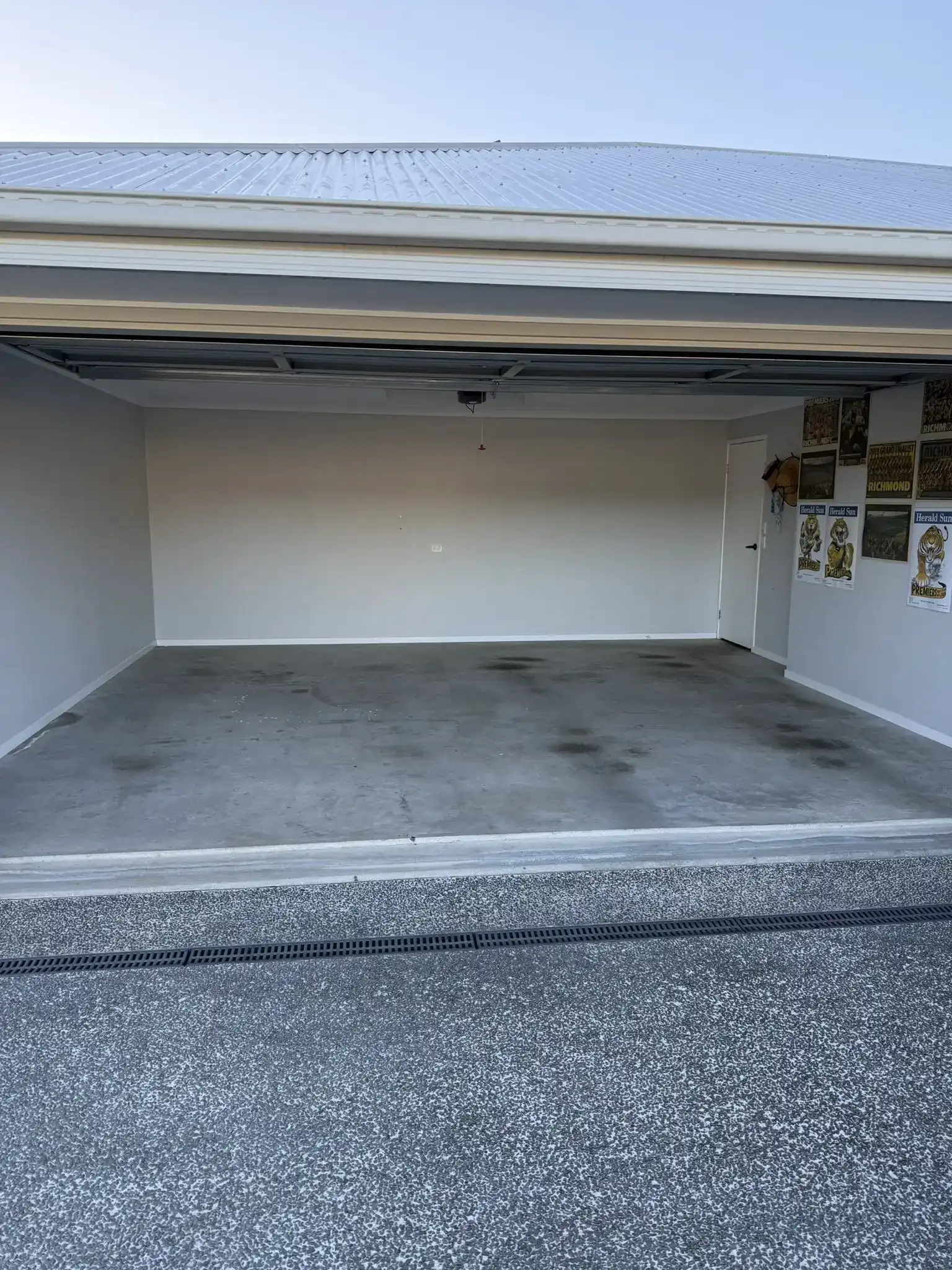 Oil-stained garage floor before diamond grinding surface preparation on Sunshine Coast