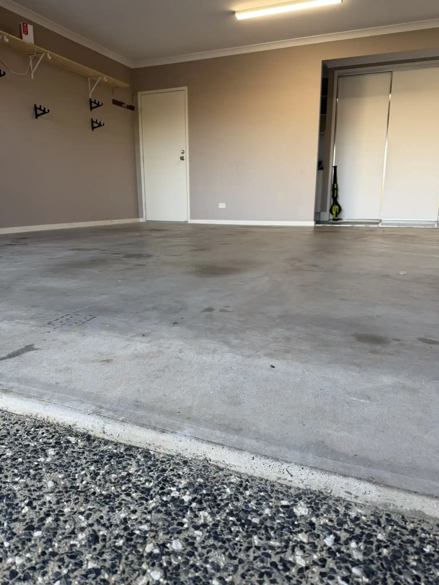Cracked concrete patio slab surfaces pre-coating on Sunshine Coast