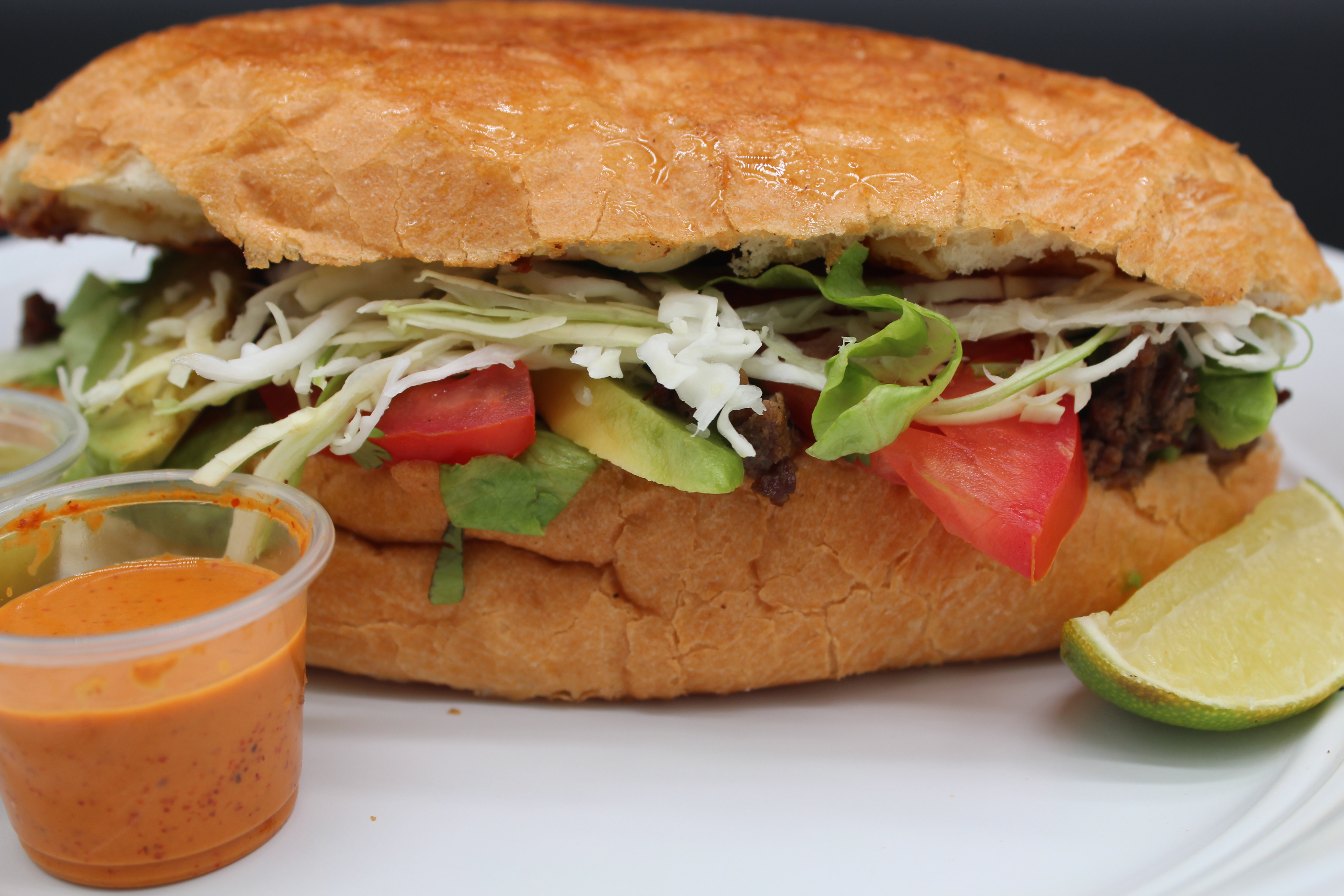 Tasty Torta with Hot Sauce and a Lime