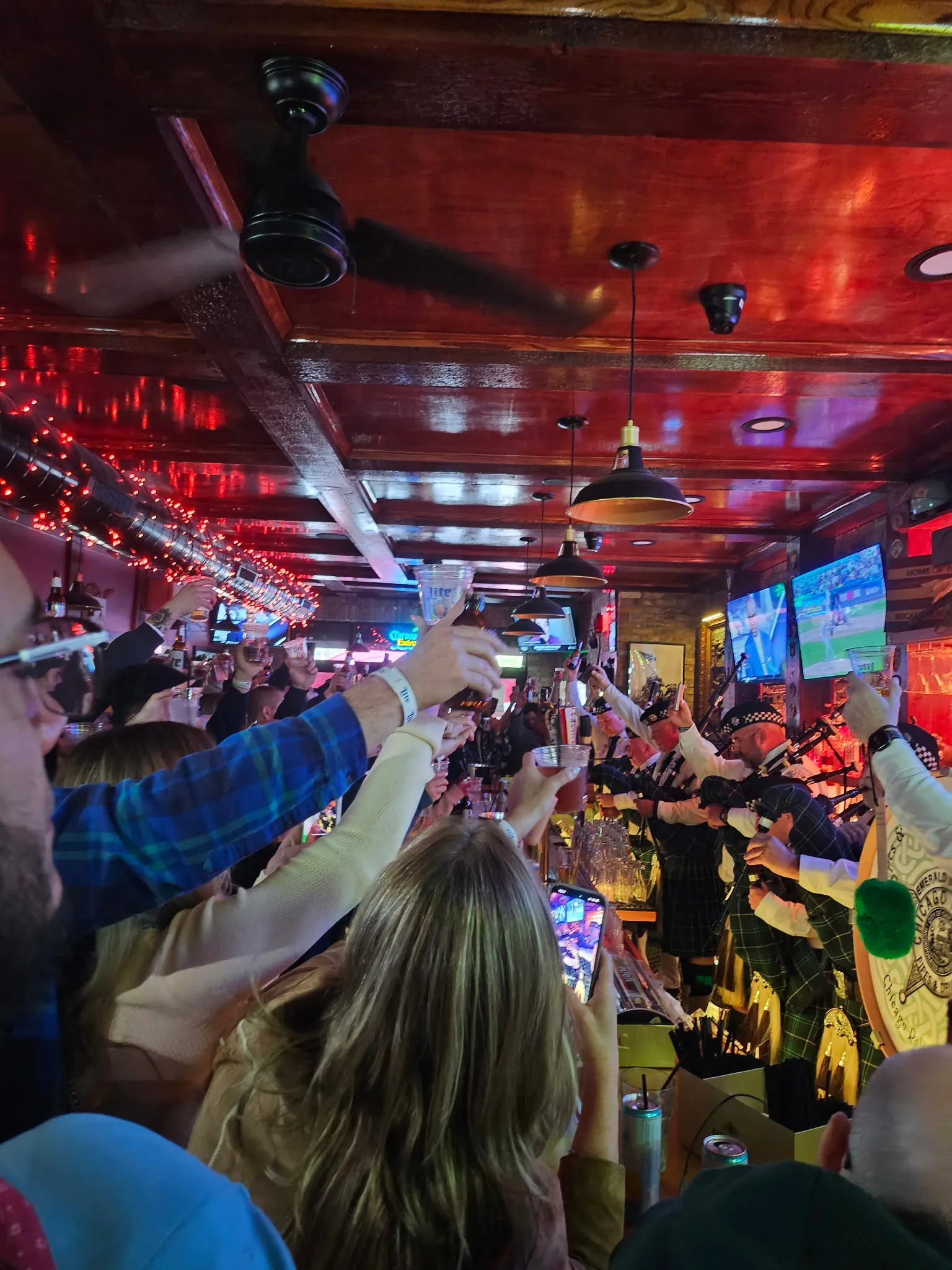 Locals at Tommy's come together to support firefighter's family and cheers to bagpipes playing in his honor
