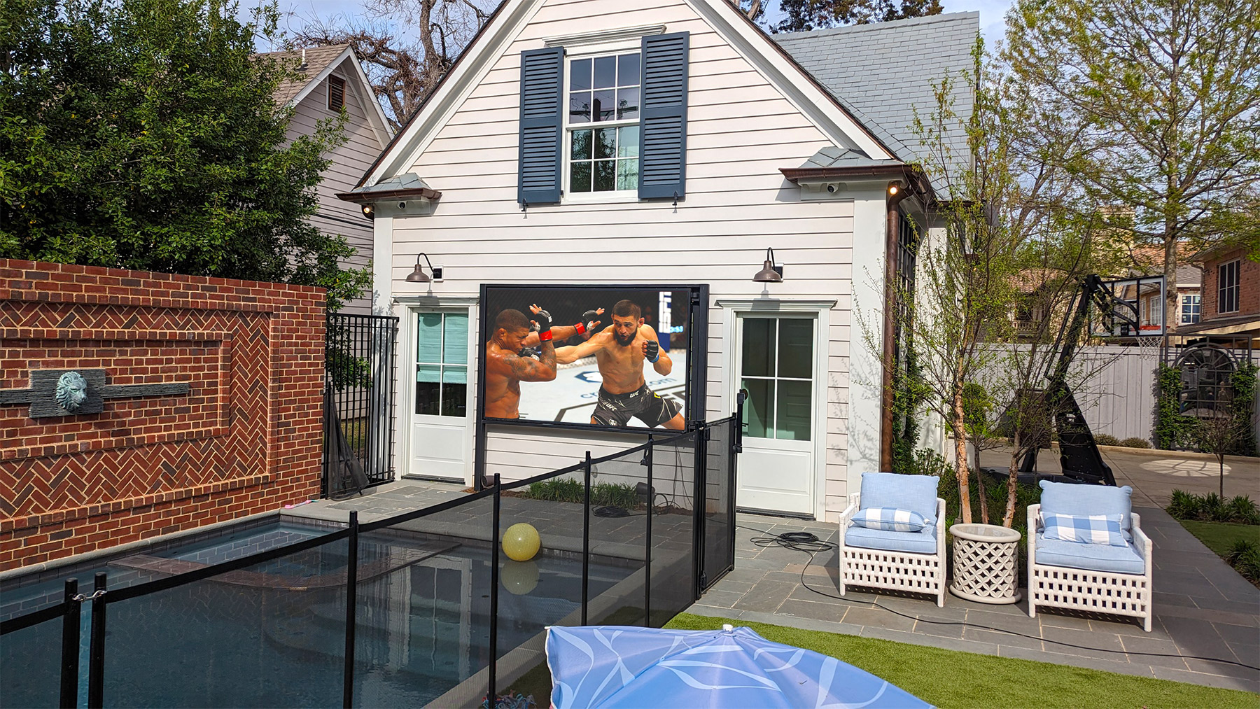 Close-up of a YOLO TV outdoor LED panel producing a bright, saturated image under intense direct sunlight