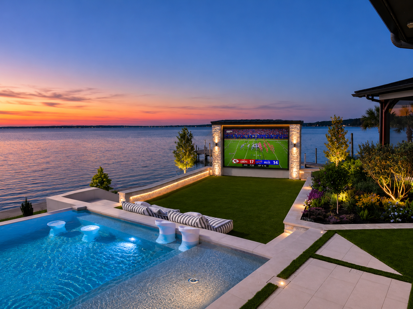 Large-format outdoor LED screen anchoring a luxury backyard gathering with family and friends around the pool deck at Lake Livingston