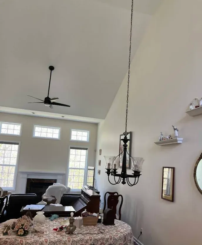 Vaulted living room with a freshly painted ceiling