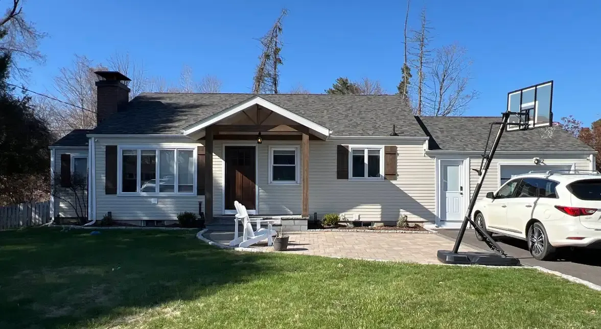Gray ranch home exterior after cleaning and painting