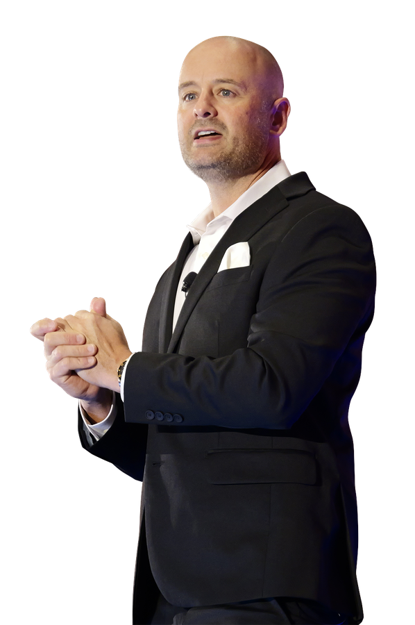 Chris Wiser, founder of 7 Figure MSP, speaking on stage.