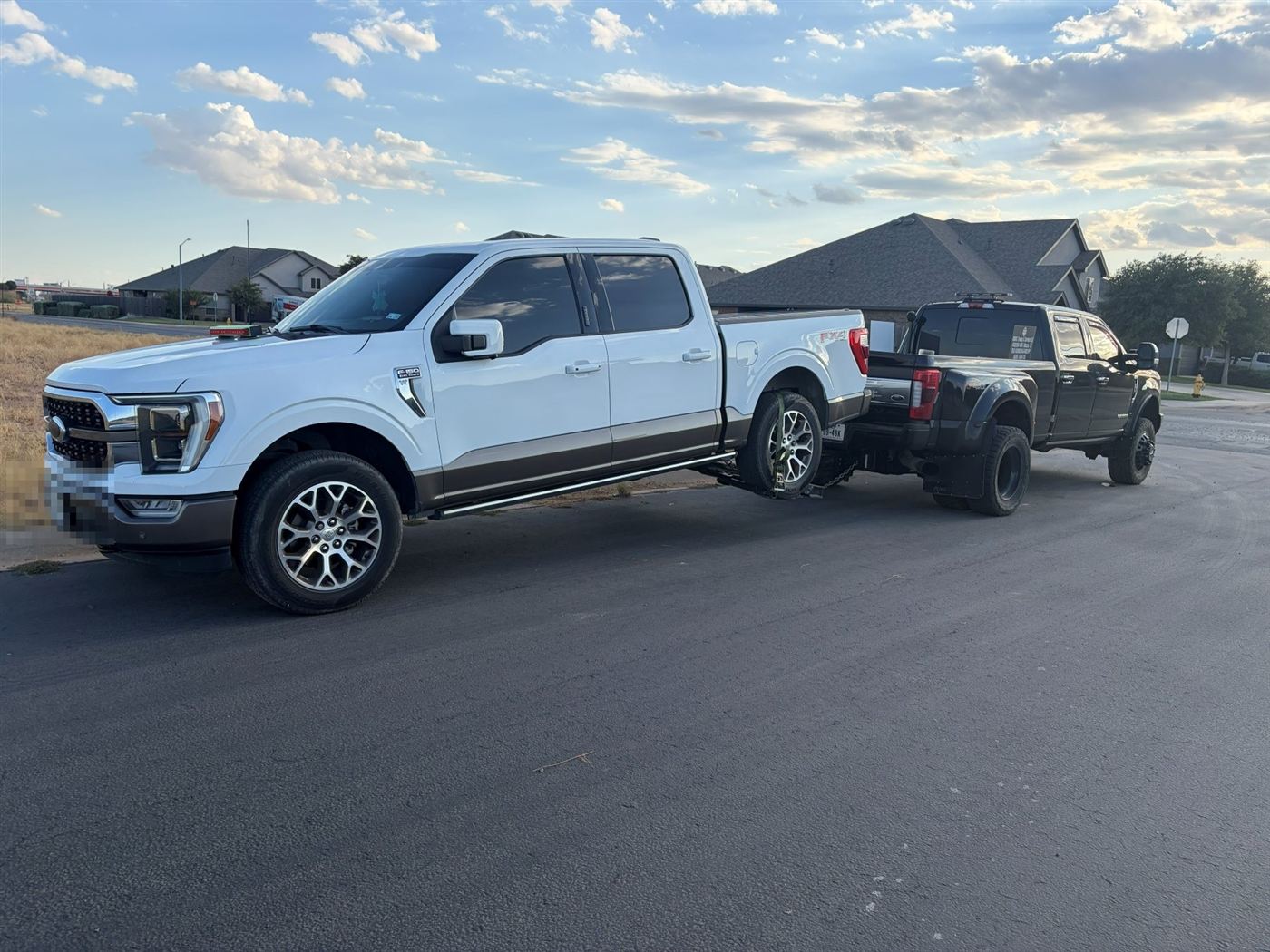 White Ford F-150 being towed