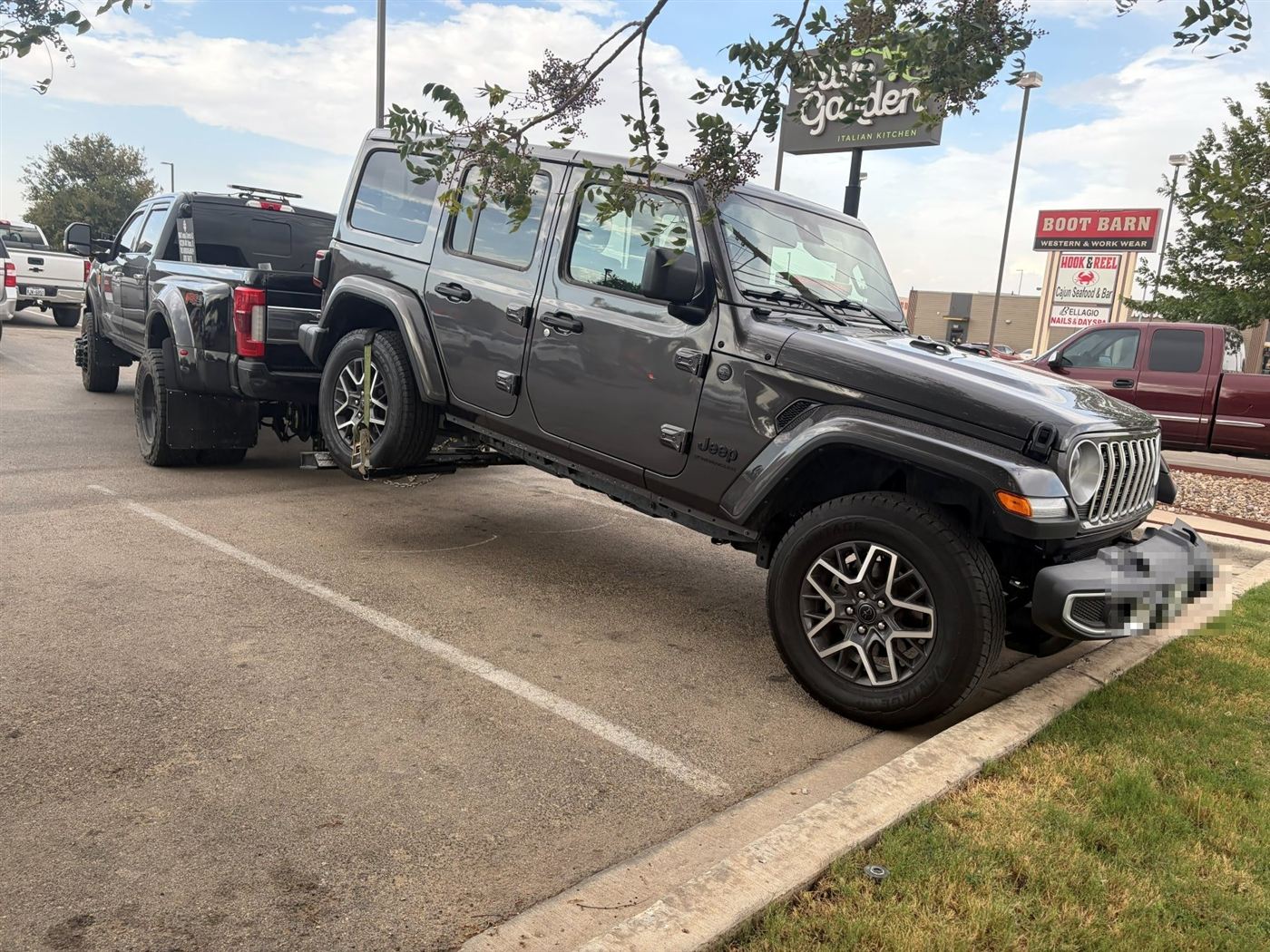 Jeep Wrangler on a wheel-lift tow