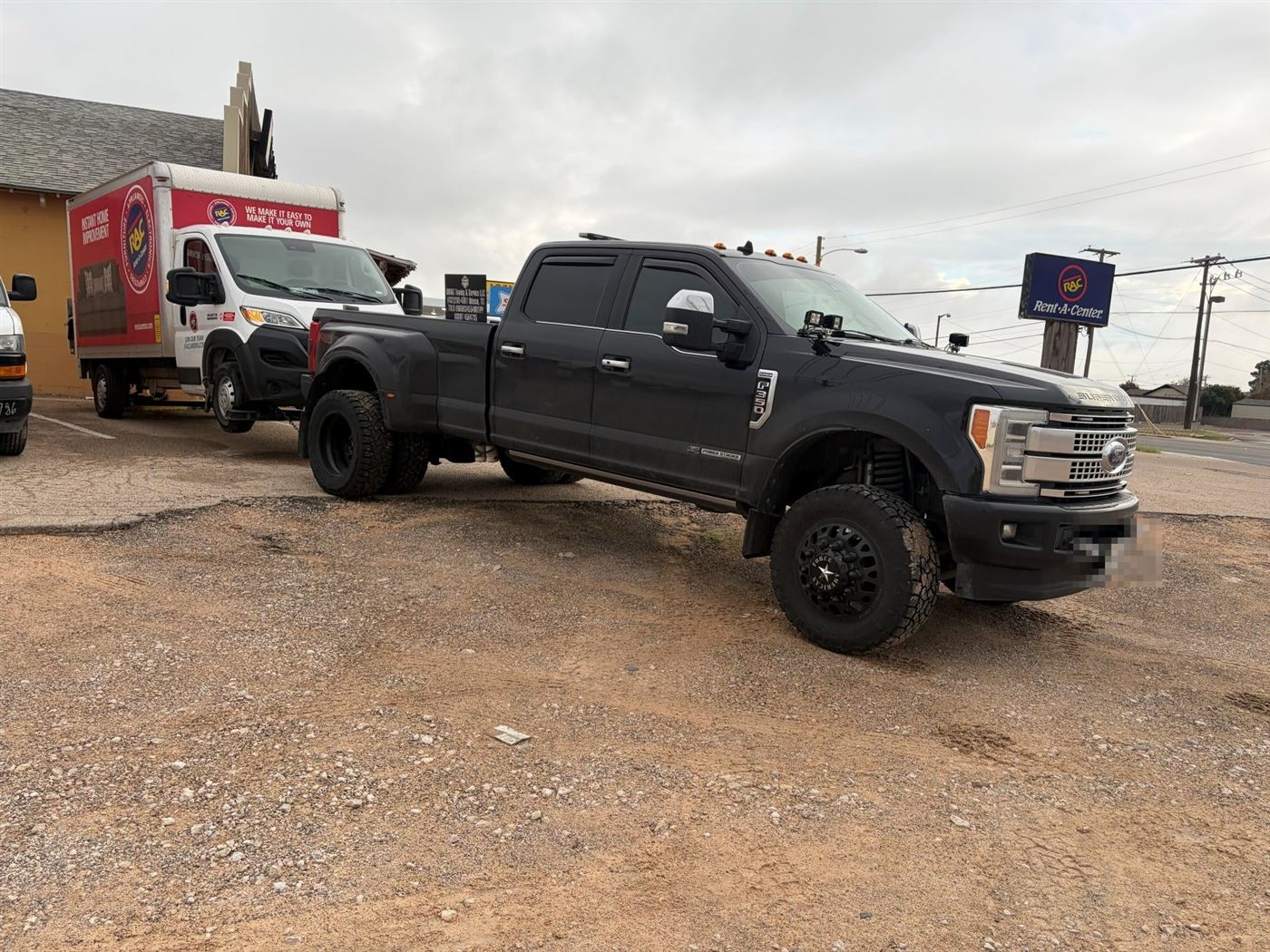 RMAG black Ford dually tow truck