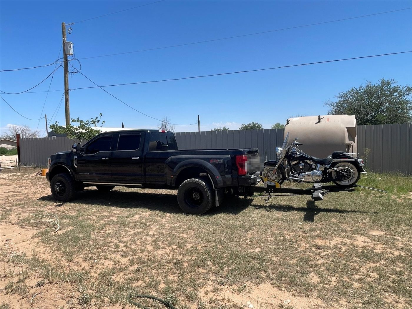 Tow truck with motorcycle on a trailer