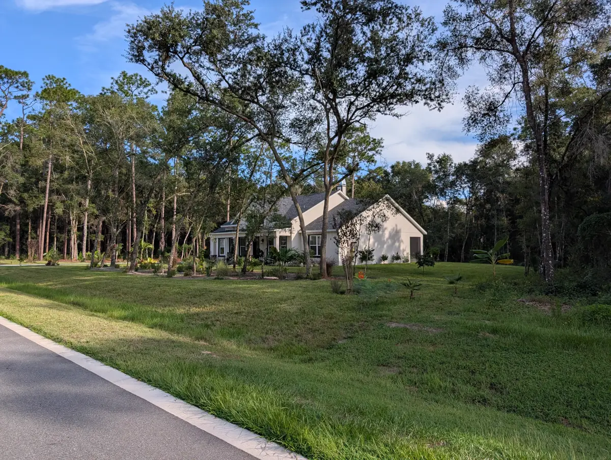 A finished home under oak trees in Heebner Acres, DeLand FL