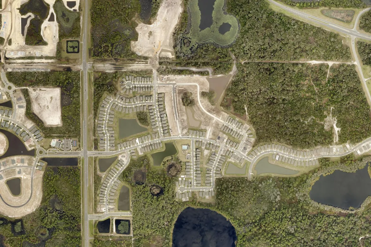 2024 Volusia County aerial photo of Lakewood Park in east DeLand, FL, new homes wrapped around small lakes