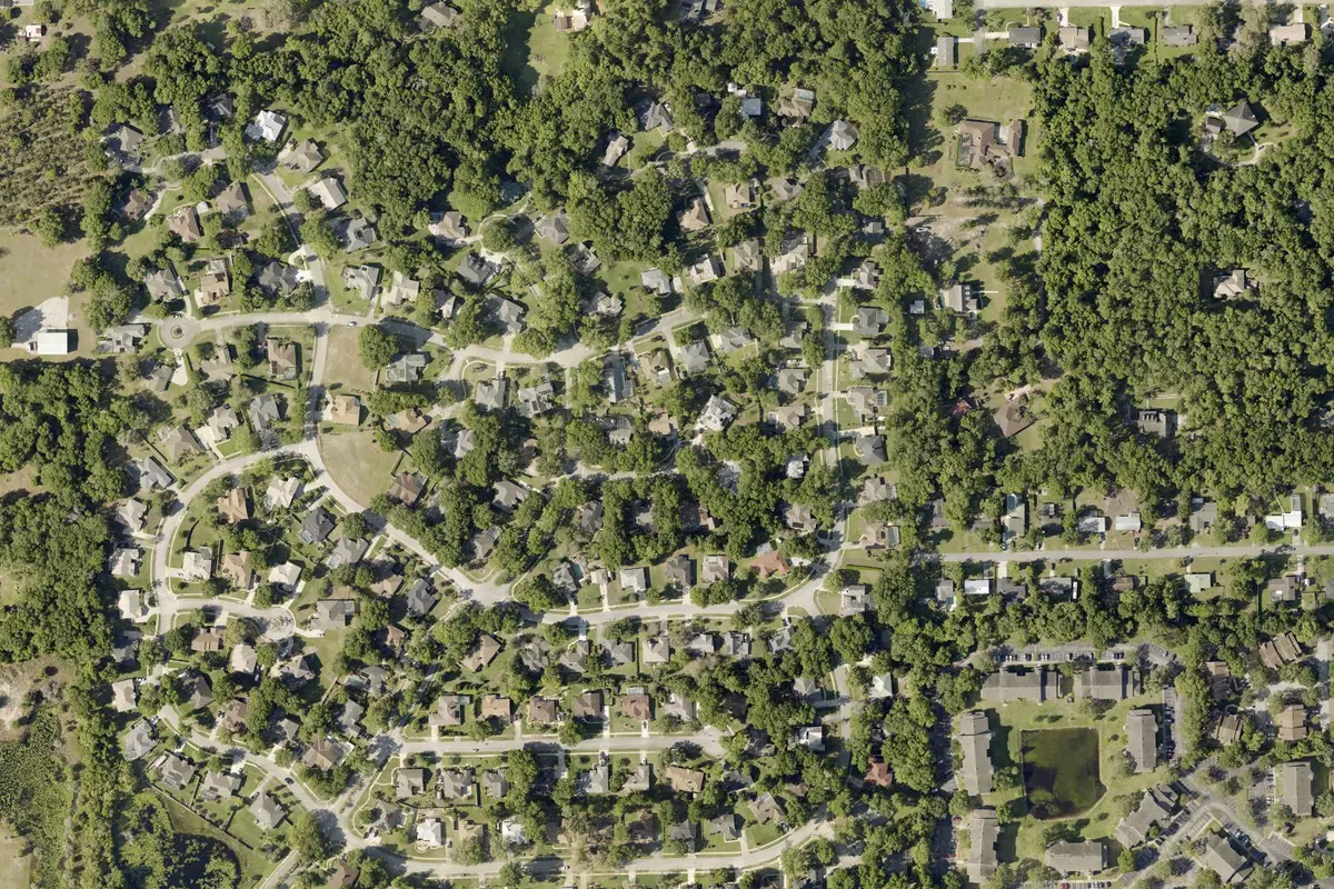 2024 Volusia County aerial photo of the Cross Creek neighborhood in northwest DeLand, FL, curving streets under tree cover