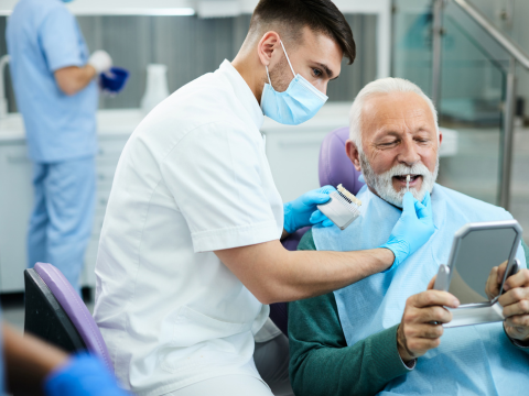 Dental care — dentist examining a patient