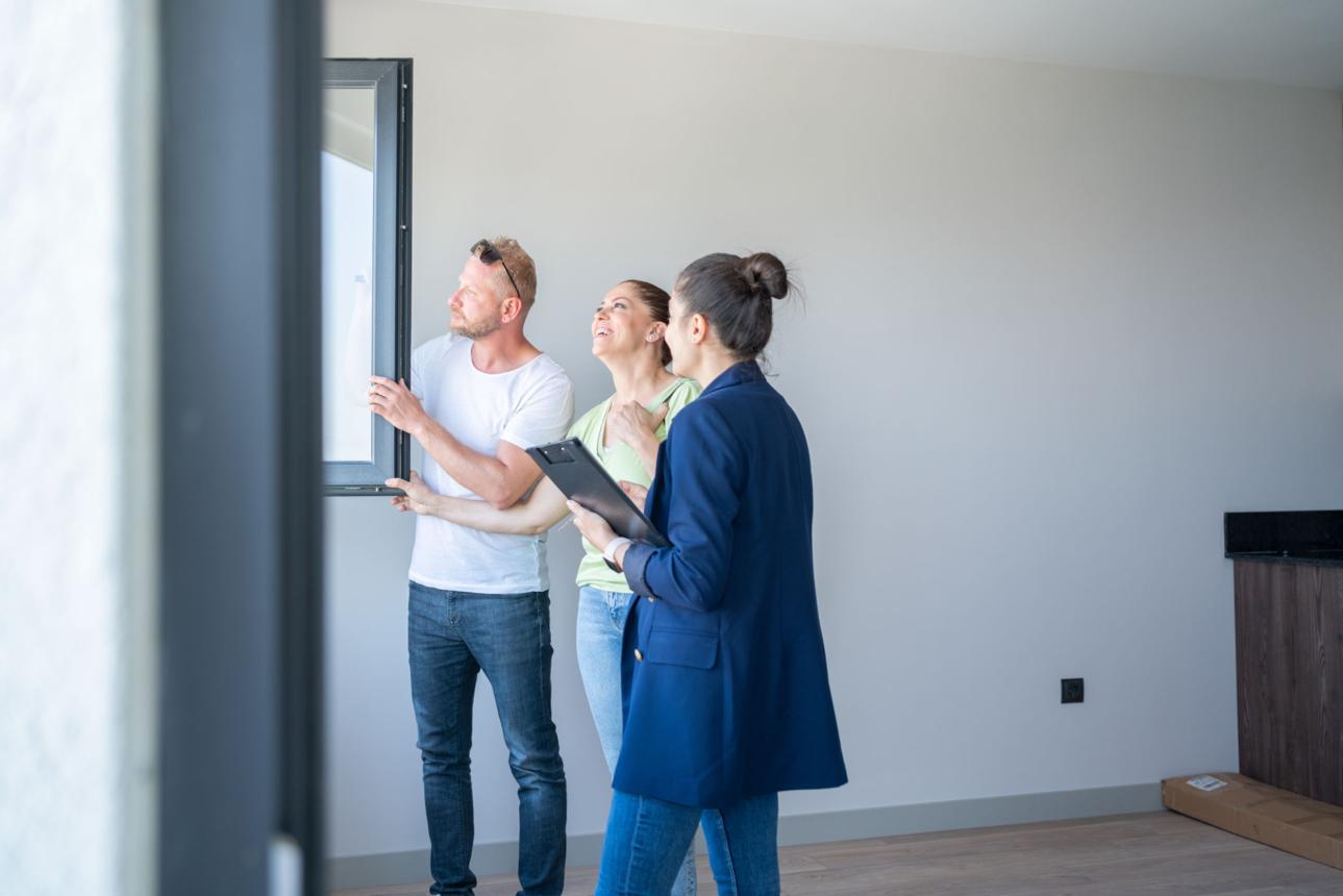 Buyers touring a home in Houston's fast-moving real estate market.