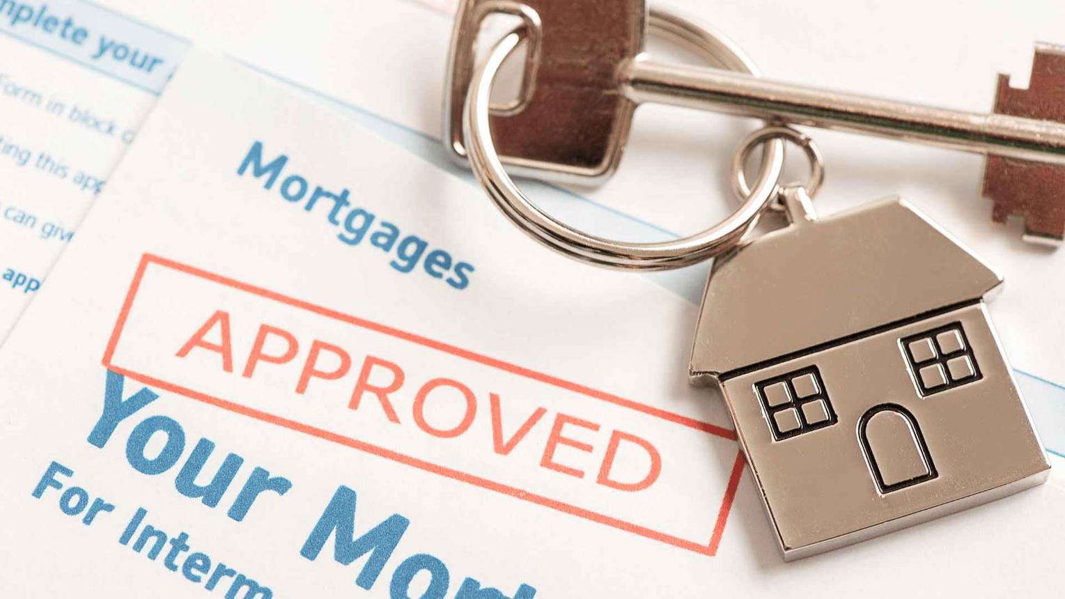 Homebuyer reviewing mortgage pre-approval documents before making an offer on a Houston home