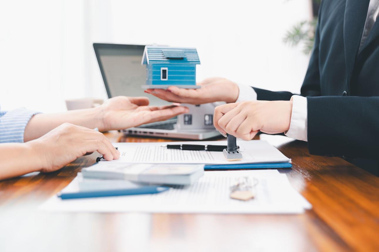 Homebuyer reviewing mortgage documents during the financing approval process.