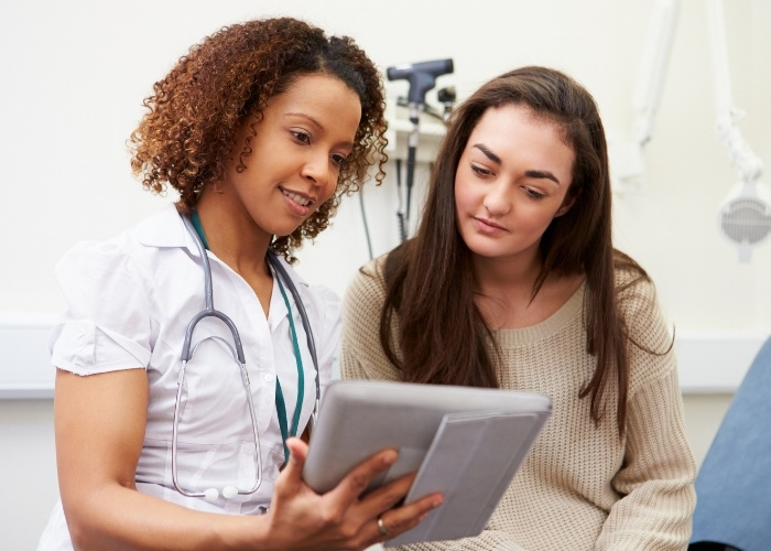 Nurse Practitioner with Patient