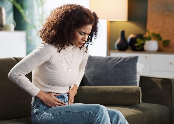 Woman Experiencing Gut Imbalance Symptoms