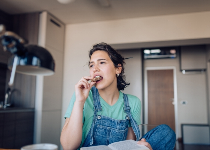 Woman Eating a Sugary Snack