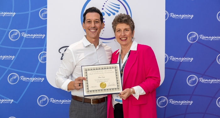 IHP Certified Health Coach with Dr. Cabral Holding Certificate