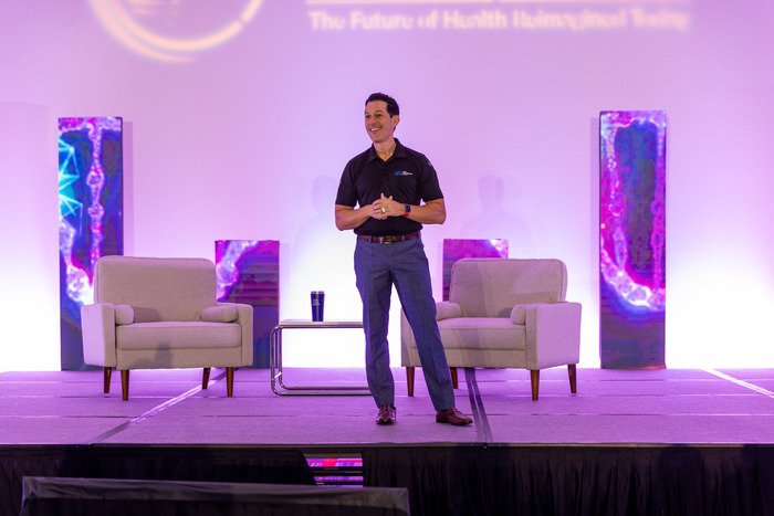 Dr. Cabral Speaking on Stage at the Reimagining Health Summit