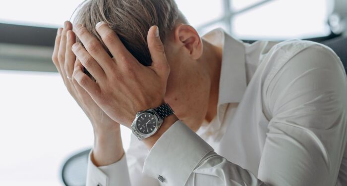 Chronically stressed man navigating men's hormones