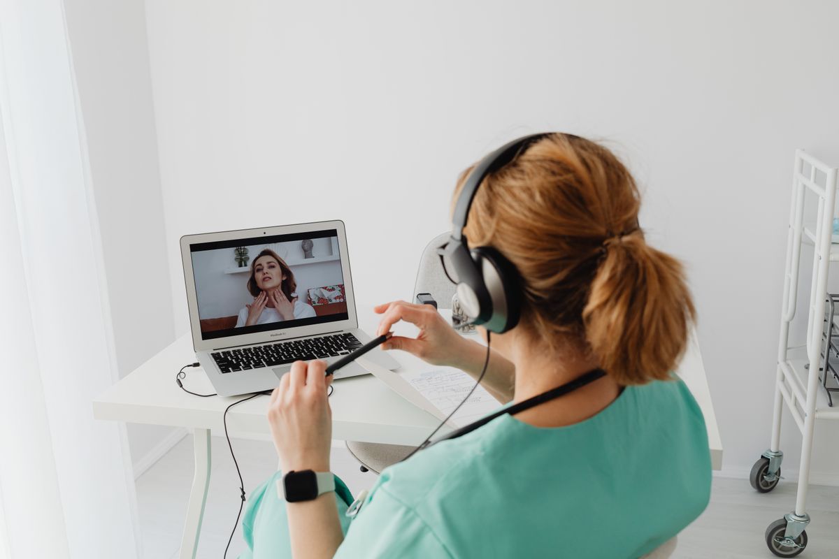 Woman on a video call with a clinician