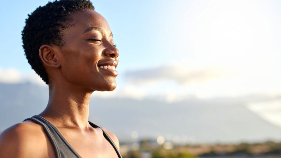 A woman outdoors at golden hour.