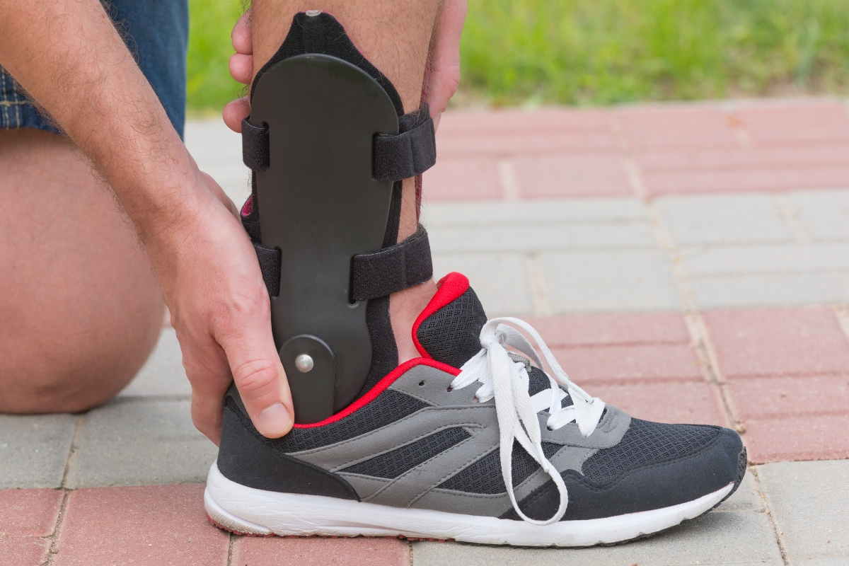 man wearing a foot and ankle orthotic device to improve gait and stability