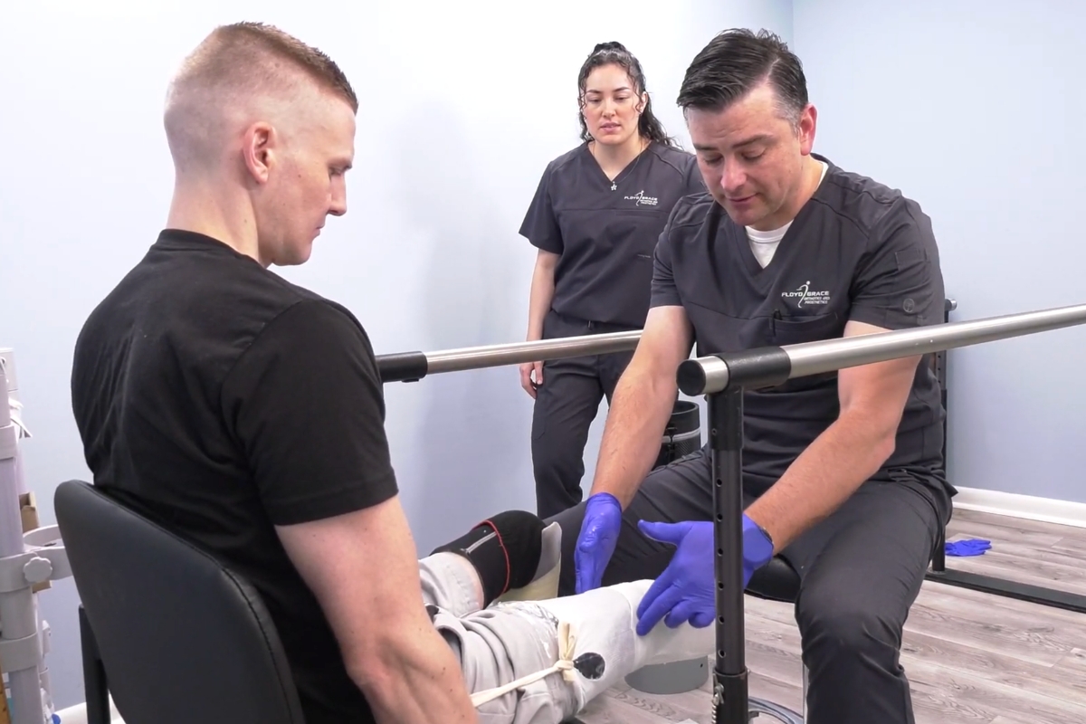Clinician taking measurements and casting a patient’s residual limb for a new prosthetic socket to ensure proper fit.