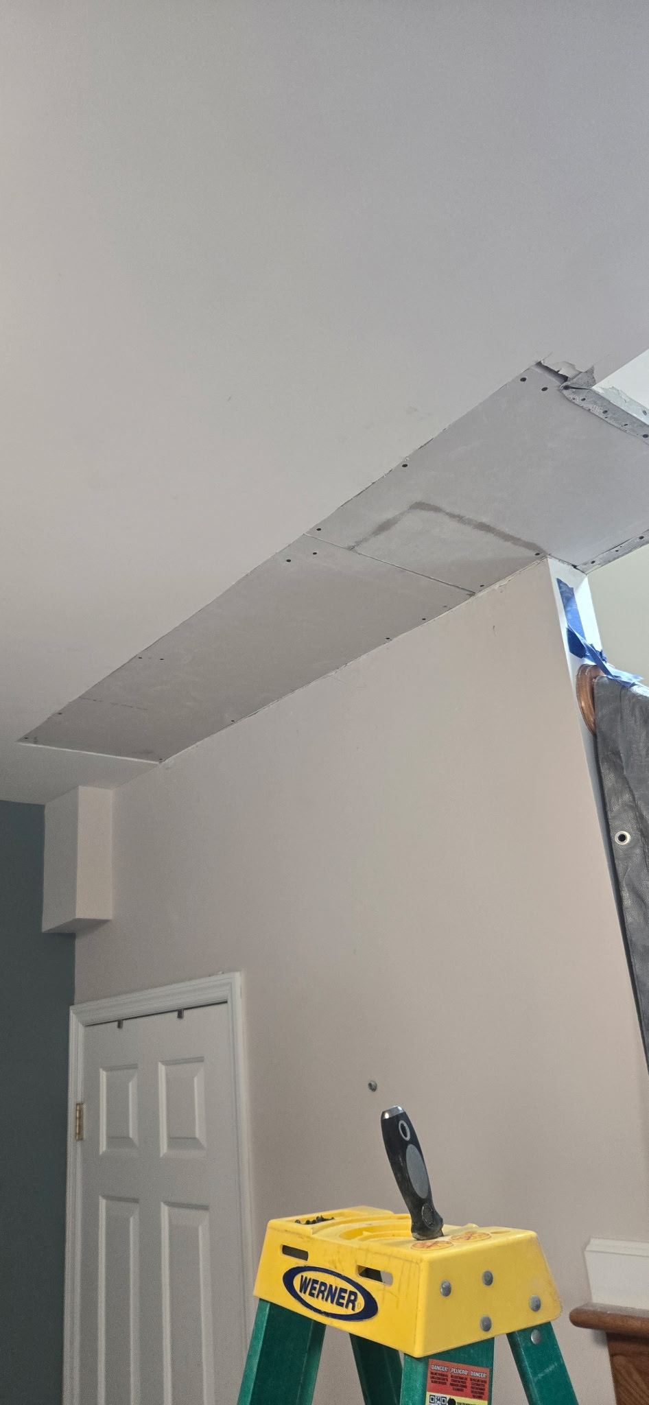 New drywall cut to fit and screwed back into the ceiling joists