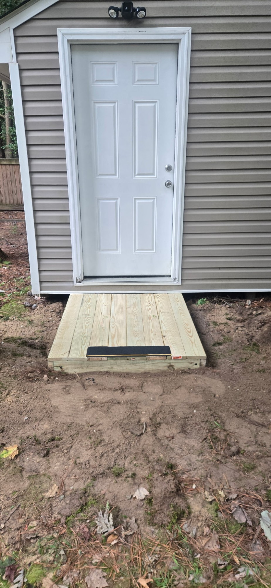 Grip strip fitted along the front edge of the finished shed step