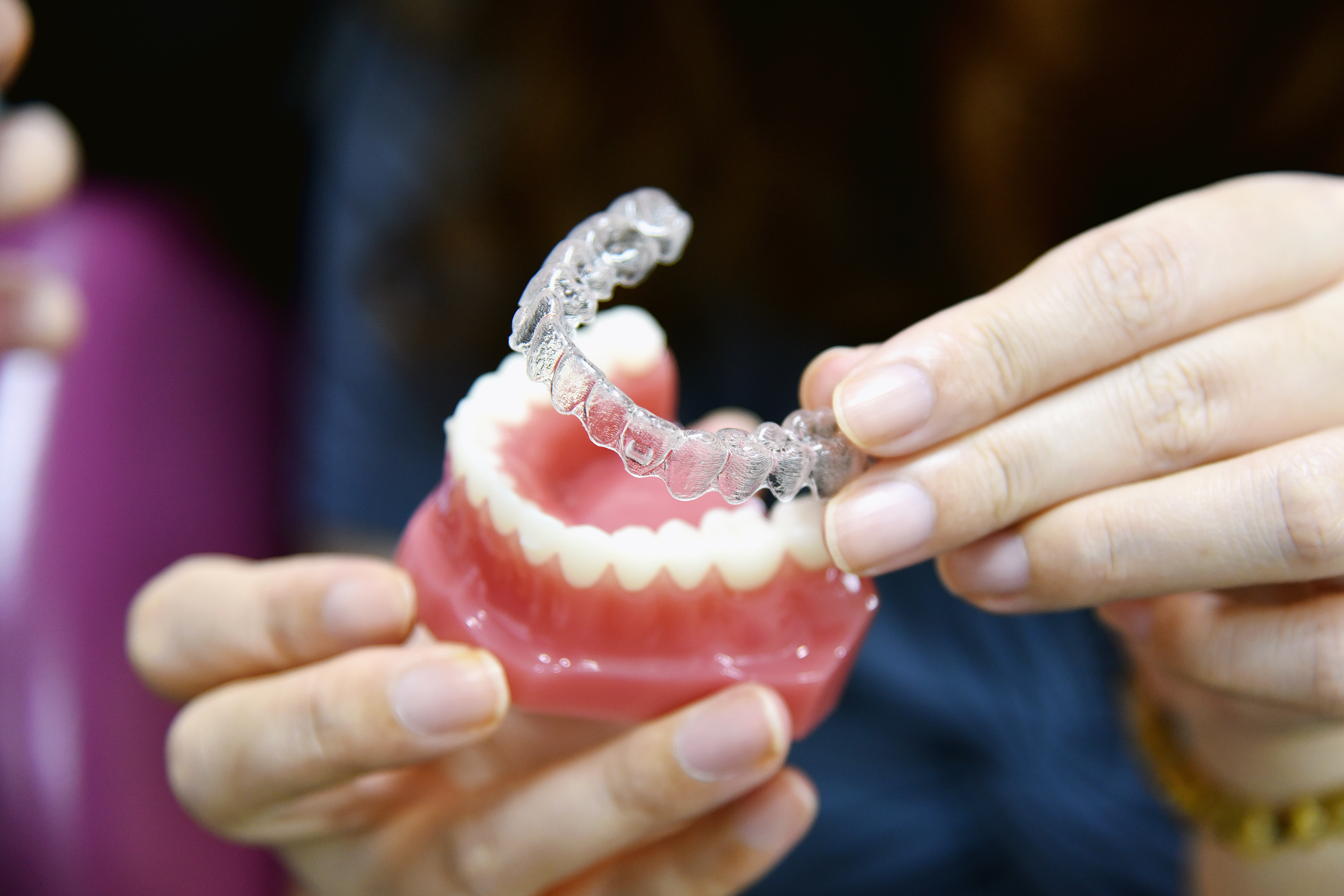 Happy Invisalign patient at Noble Smile in Katy, TX