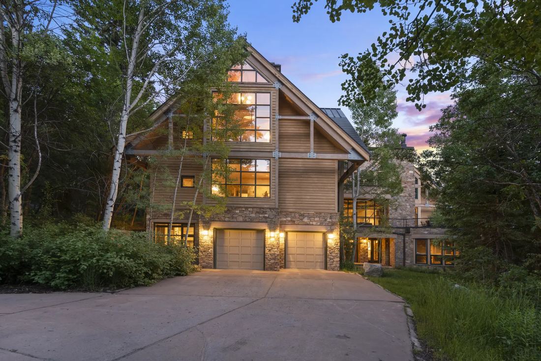The lodge among aspens at evening