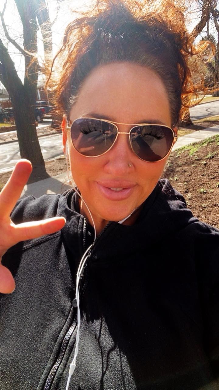 Mama Tiff walking outdoors, embracing small steps of healing and reclaiming her life, showing empowerment and determination.