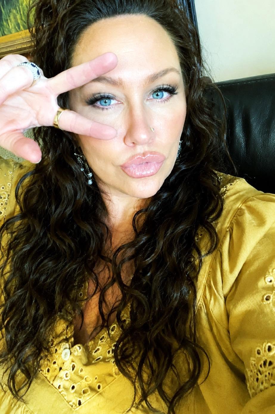 Woman embracing feminine power and emotional healing while processing grief, rage, transformation, and spiritual awakening.