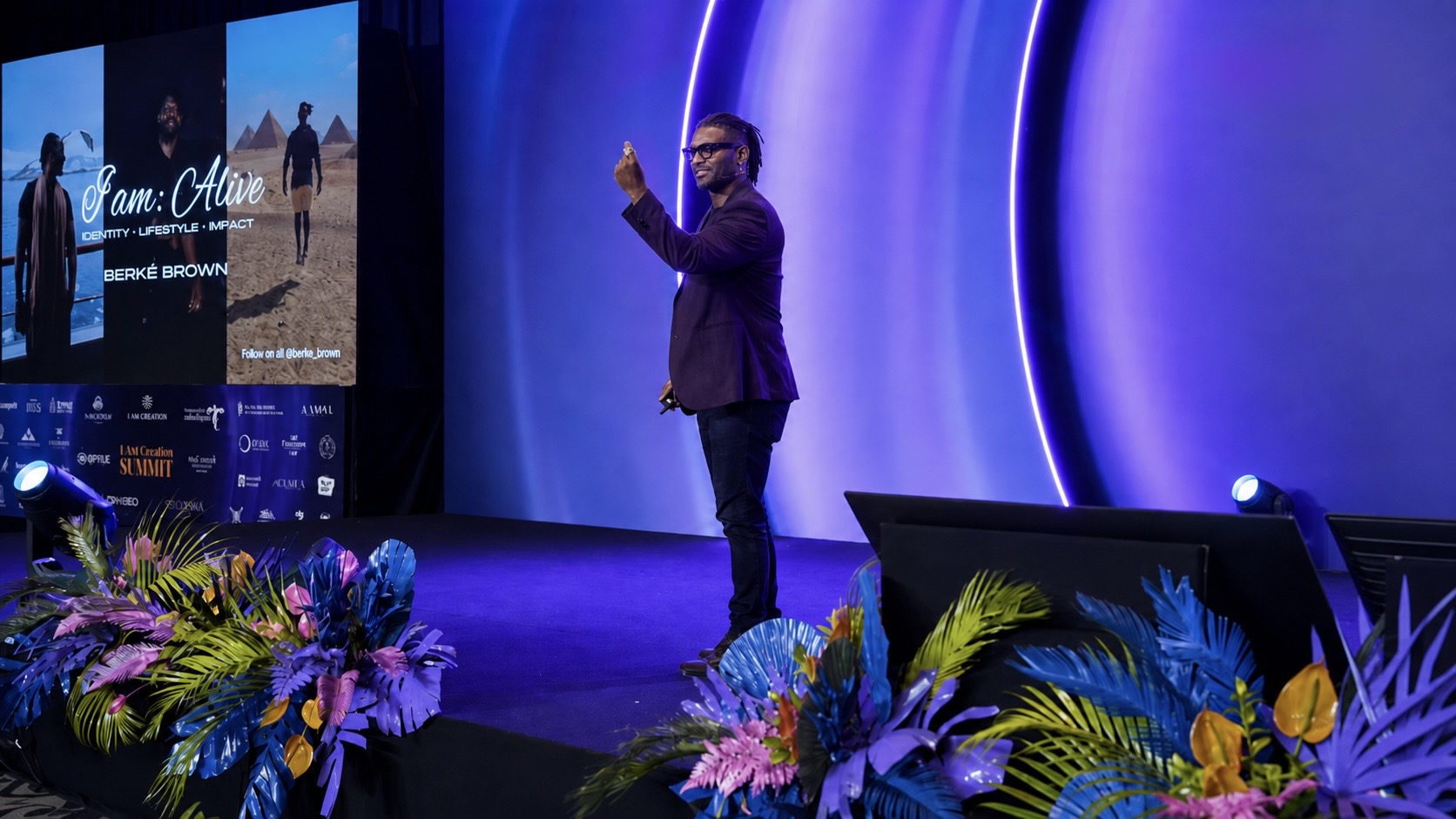 Berké Brown speaking on stage