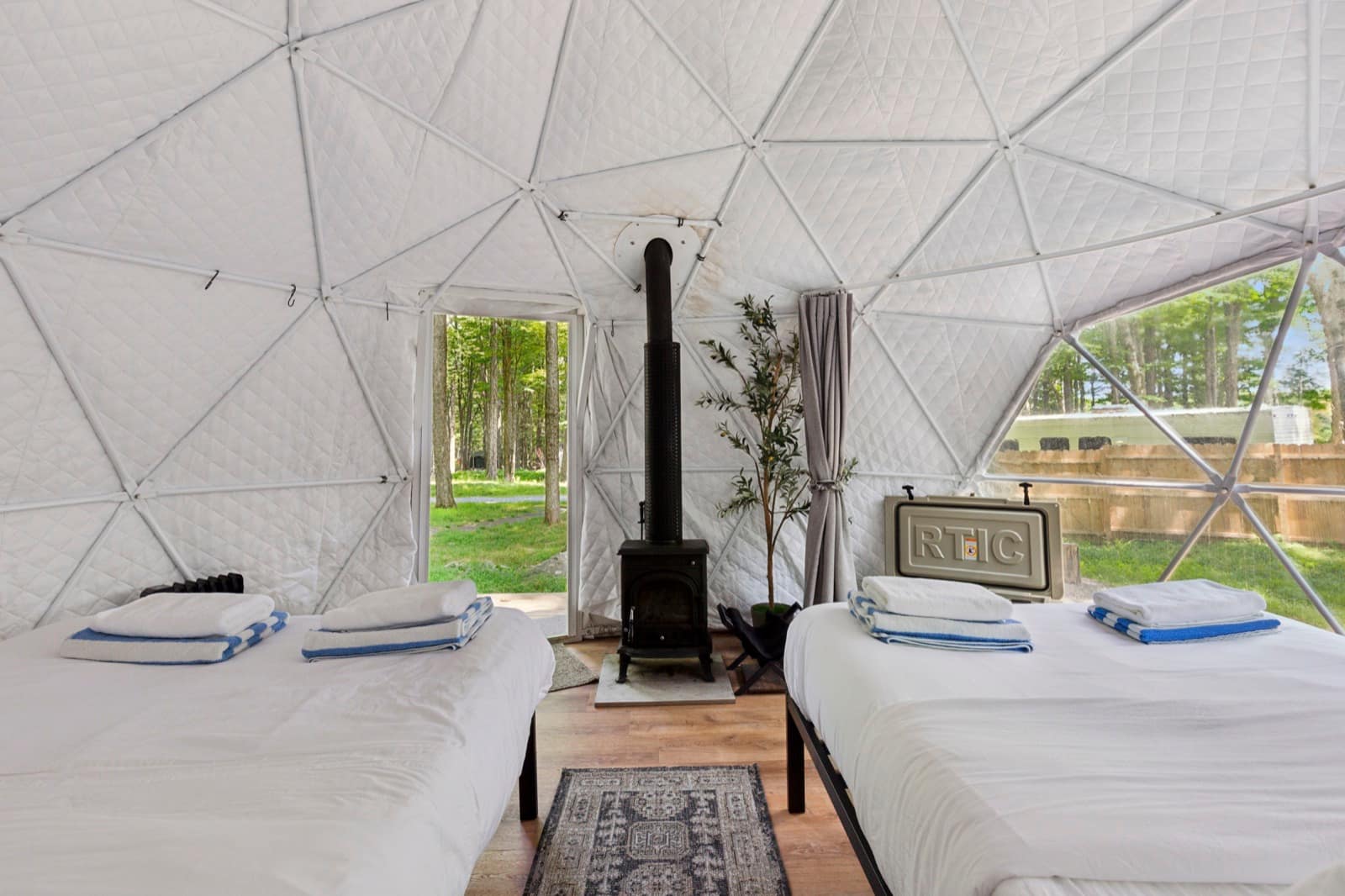 Dome interior with wood stove and two beds