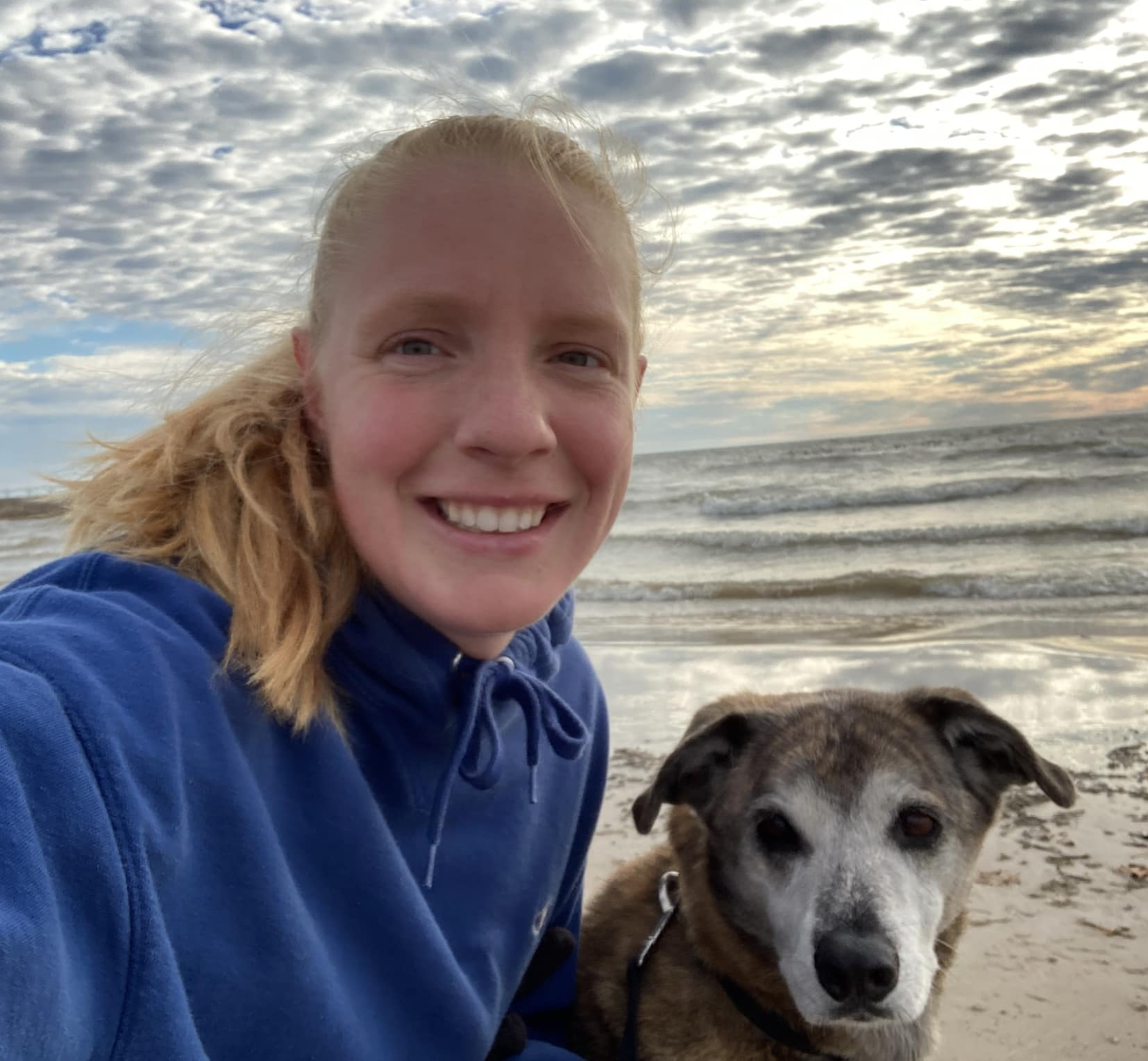 Dr. Amber Vanden Avond with her dog at the beach in Algoma, Wisconsin