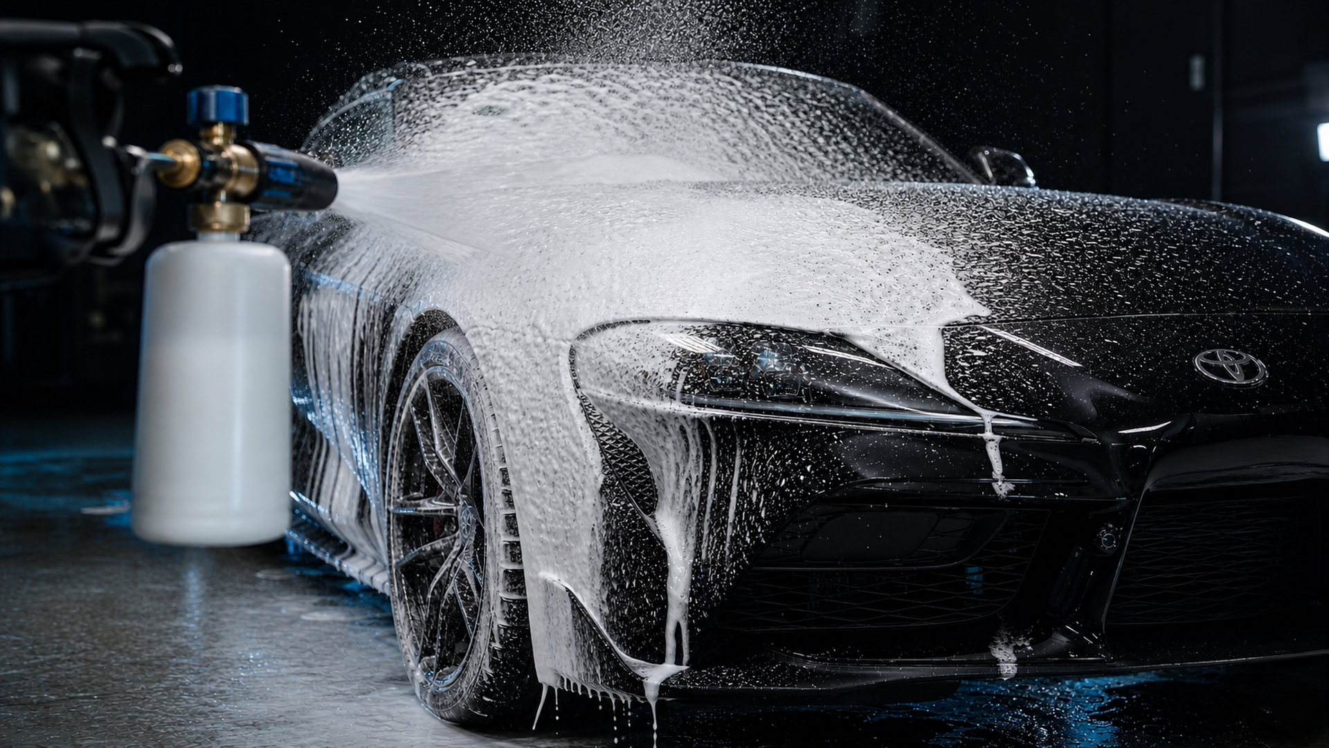 Foam cannon pre-soak on Toyota Supra in detailing studio
