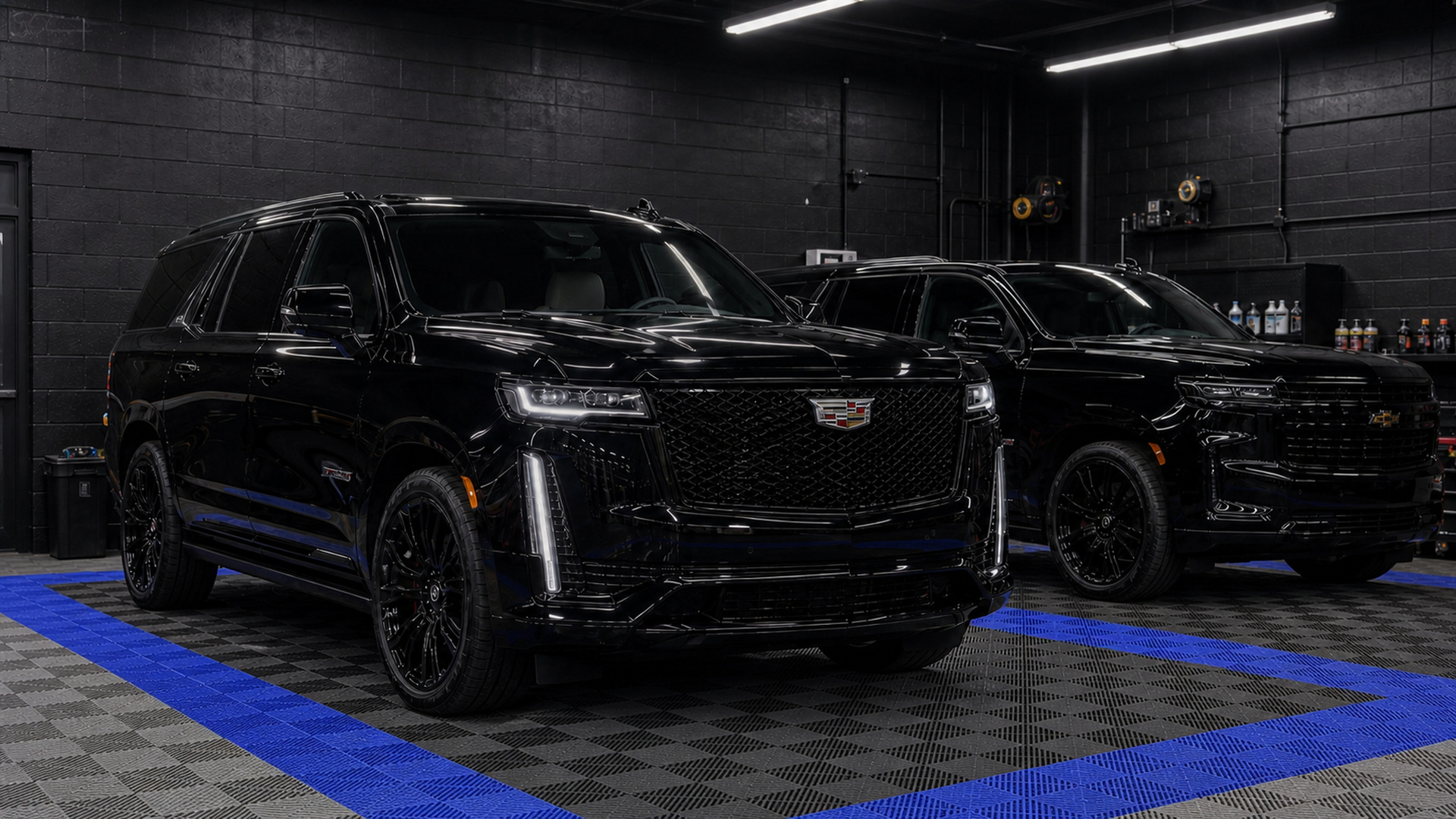 Two black full-size SUVs on one household membership