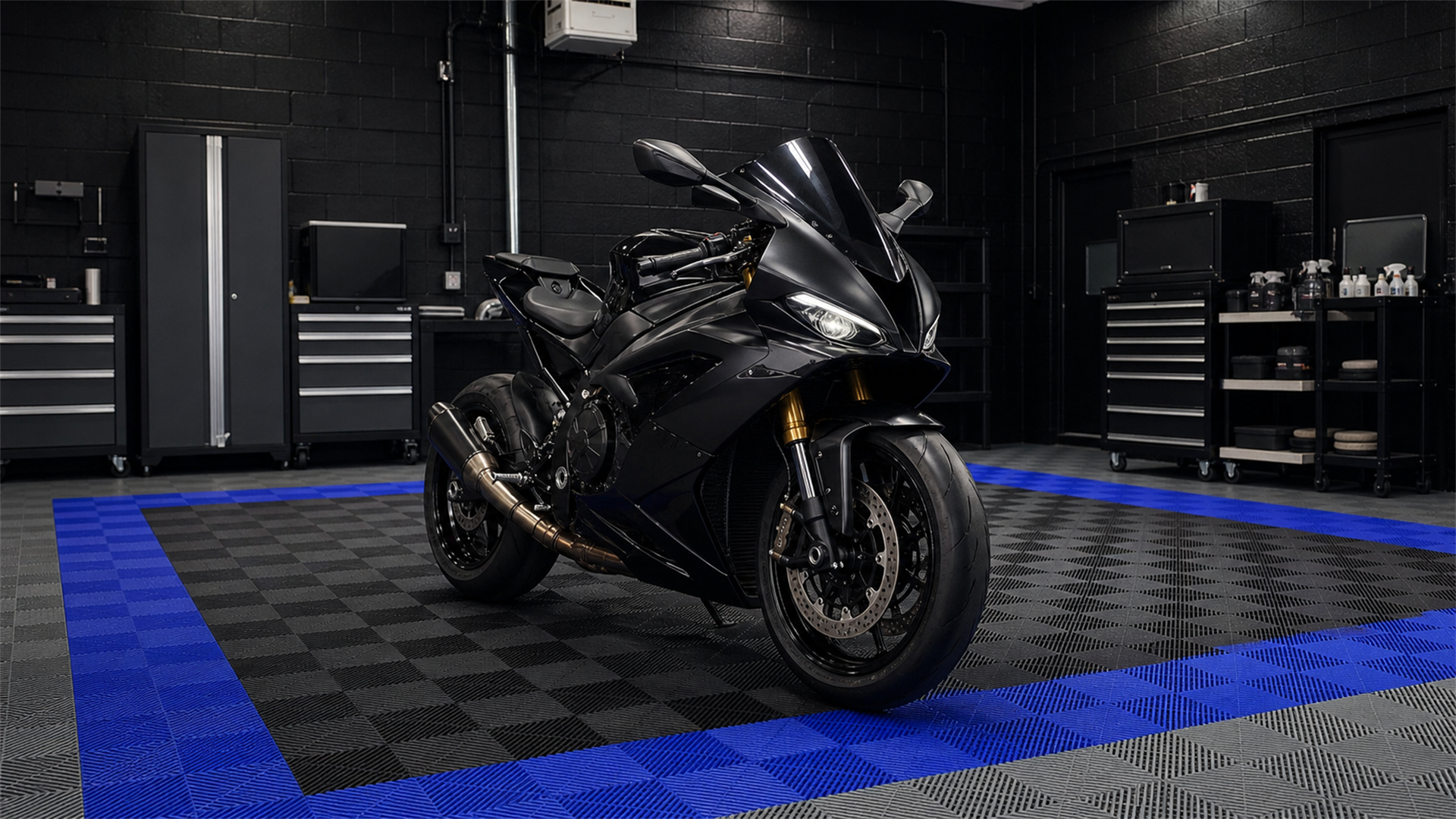 Unbranded black sport motorcycle inside the Refined Rides detailing bay