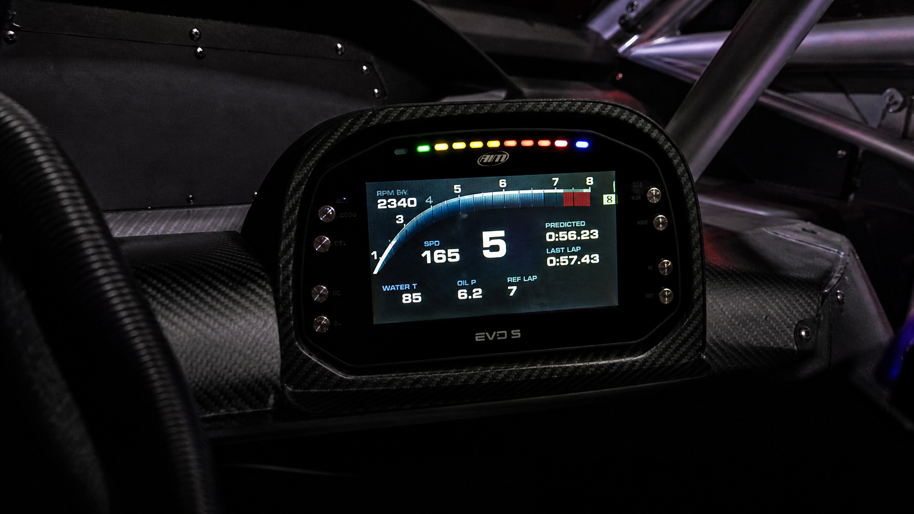 AiM EVO5 dash logger in race car cockpit — data acquisition installs Houston TX