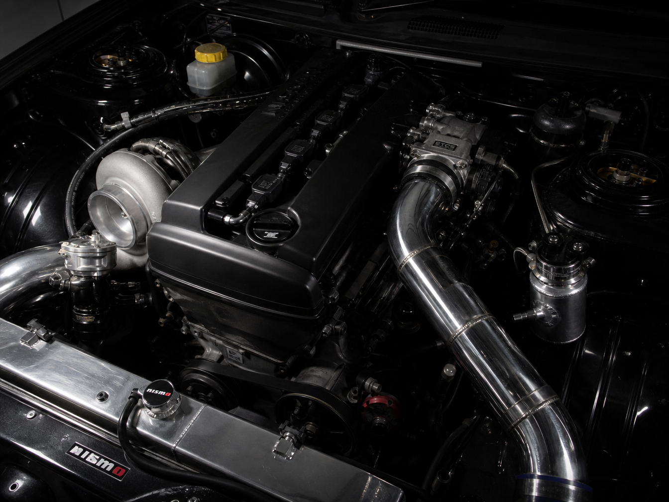 Turbocharged street car engine bay — forced induction builds Houston TX