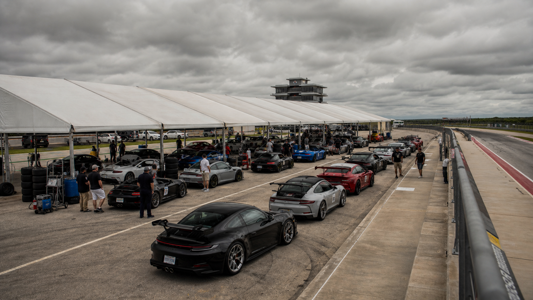 PCA Gulf Coast track event paddock — Porsches lined up at a Texas road course
