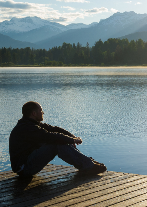 Man reflecting, representing the emotional struggles and challenges men face on their personal growth journeys.