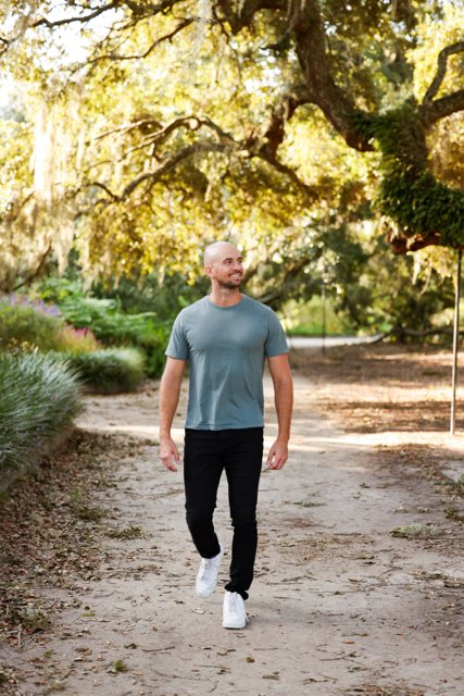 Anthony Speeney walking along a nature path, symbolizing reflection and personal growth.