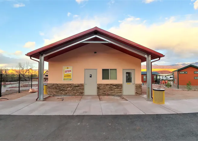 Commercial metal building with a service bay and storage area.